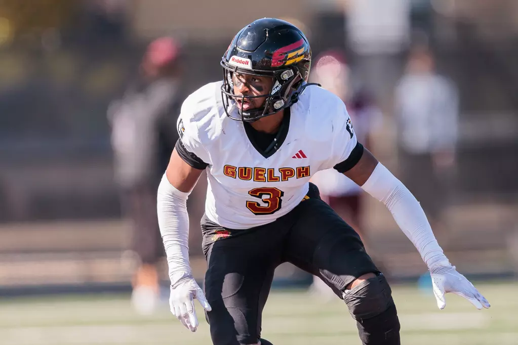 Miles playing college football at Guelph